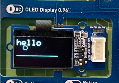 An OLED displaying 'Hello' and a circle.